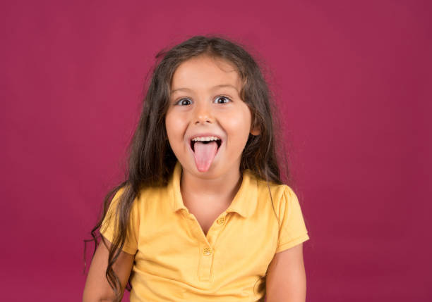 istock Cute little girl making a face 1197736328