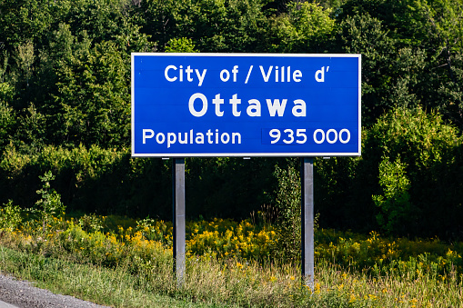 Ottawa city entrance Information Road blue Sign on the roadside, Canadian two languages French and English signs, Ville d'ottawa, Canada