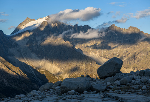 View from the end of the Mandrone glacier to the mountain cima presanella at the late evening light. It is located in the Adamello Brenta Nature Park (European Alps, Italy).