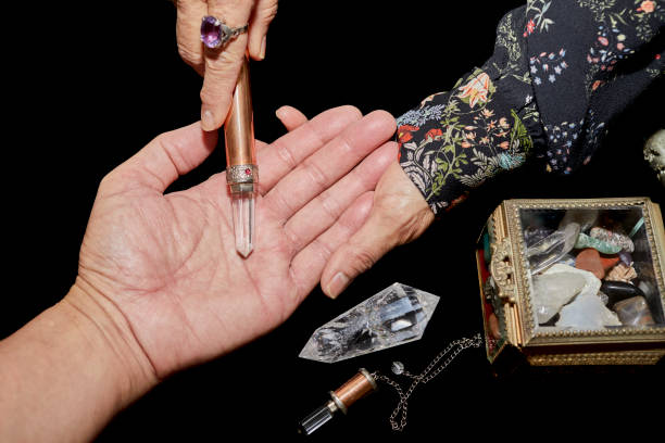 istock A Spiritual Healer using a Crystal Wand on a Man's hand 1197742466