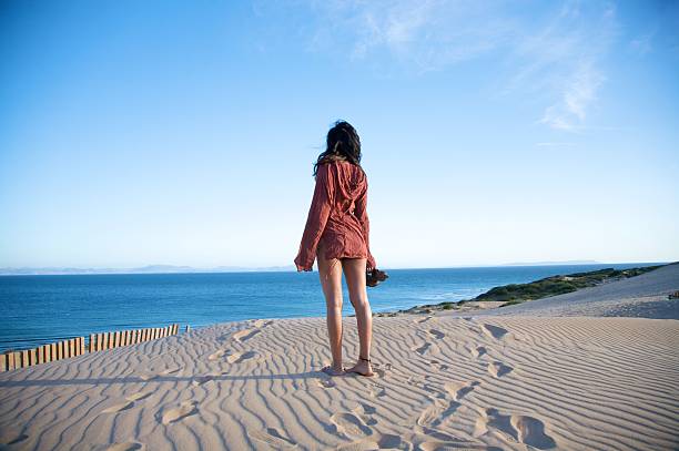 istock sexy woman at valdevaqueros dunes 119774283