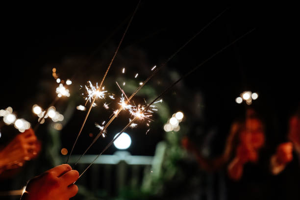 istock Hands of people holding Bengal light 1197744242