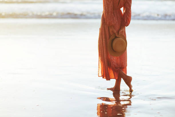Young woman running on seaside path.