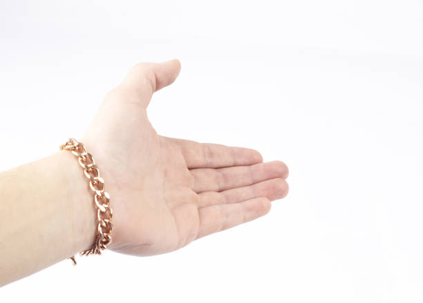 istock closeup.businessman holding out hand for a handshake 1197754594