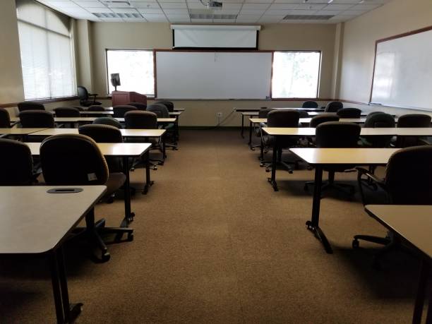 istock Back of classroom view with white boards and projection screen at front 1197757409