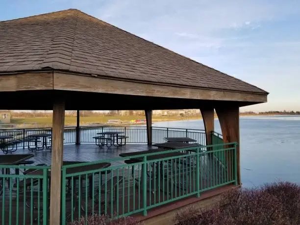 Photo of Large waterfront gazebo with picnic tables side view