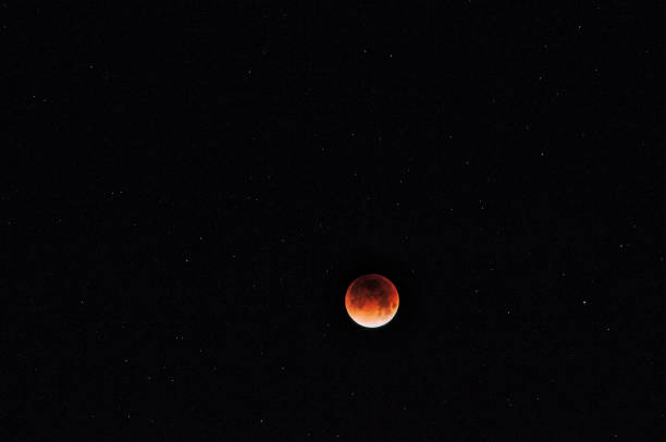 istock Blood Moon illuminated against the dark and starry sky 1197758639