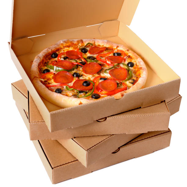 istock Freshly baked Pizza with stack of delivery boxes 1197759608