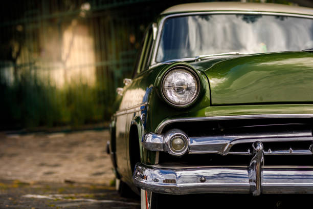 Parked vintage classic green car Parked car. vintage car stock pictures, royalty-free photos & images