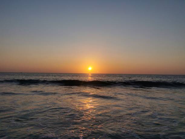istock Sunset with cloudy sky on the sea 1197764884