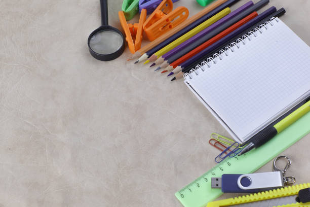 istock Notepad for taking notes and school supplies on a paper background .photo with copy space 1197768225