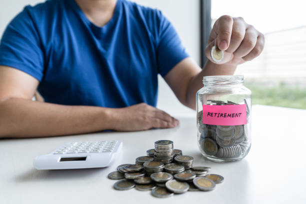 istock Man putting coins to planning growing saving to strategy with money box for future plan fund of travel , education, home and retirement 1197768412