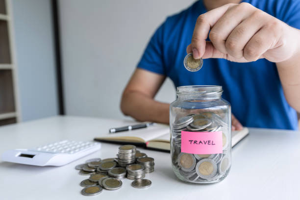 istock Man putting coins to planning growing saving to strategy with money box for future plan fund of travel , education, home and retirement 1197768414