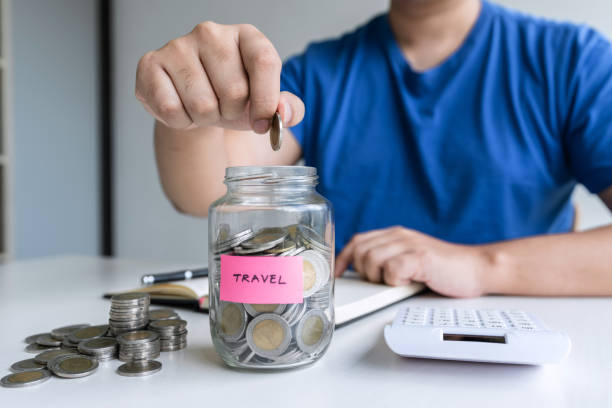 istock Man putting coins to planning growing saving to strategy with money box for future plan fund of travel , education, home and retirement 1197768423