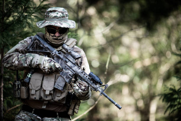 istock Tactical jungle Military hunter camouflaged 1197769342
