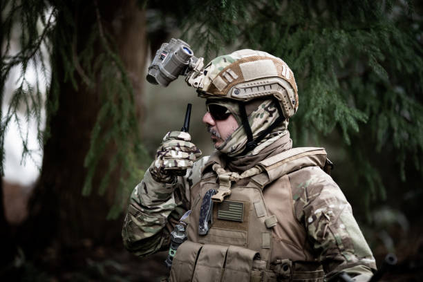 Tactical jungle Military man talking on a walkie talkie
