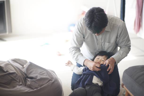istock Father changing baby boy at home 1197769928
