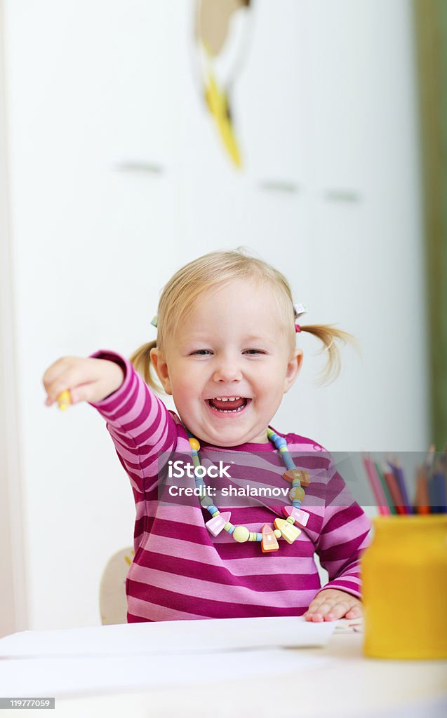 Happy girl with coloring pencils  Casual Clothing Stock Photo