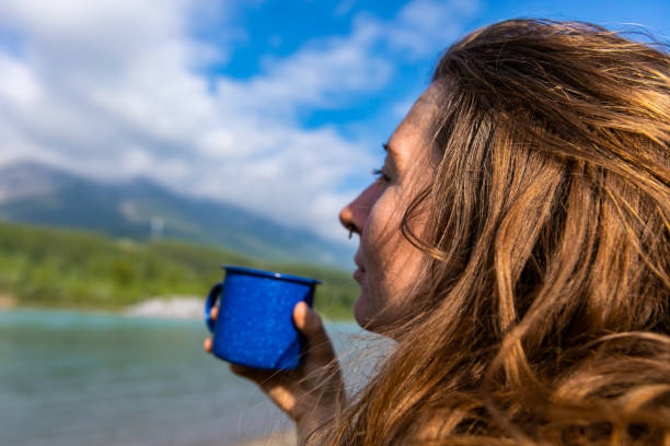 istock Woman drinking coffee with great view 1197770939