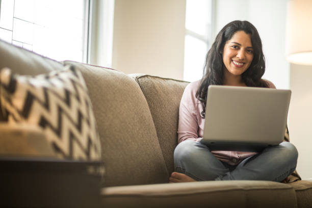 istock Hispanic woman at home working on a computer. 1197772028