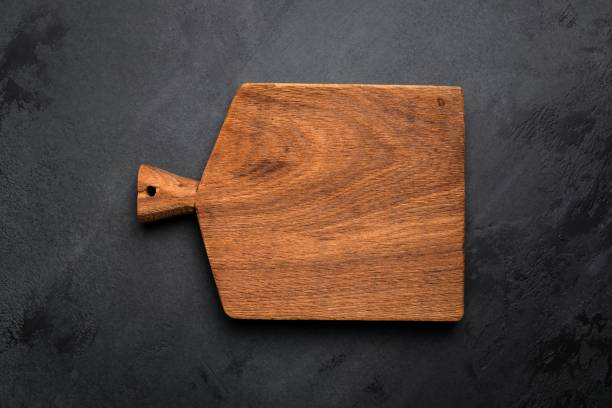 istock Chopping cutting board on black concrete background 1197773874