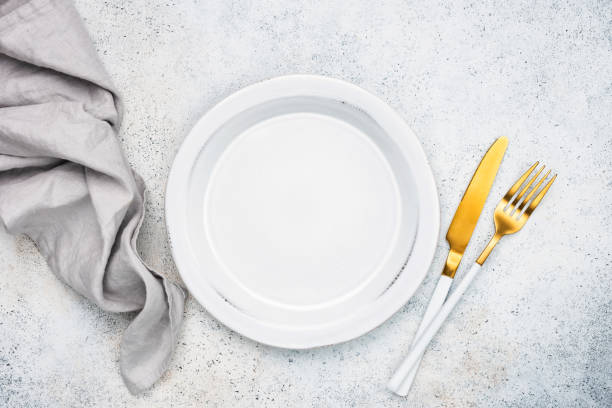 istock Empty plate and golden cutlery 1197773885
