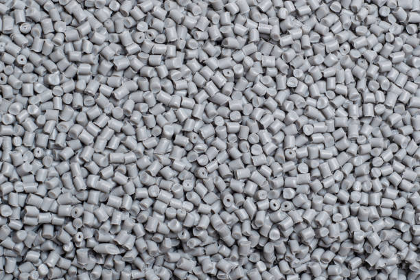 istock CLOSE-UP OF PLASTIC POLYMER GRANULES SPREAD ON EVEN SURFACE 1197774934