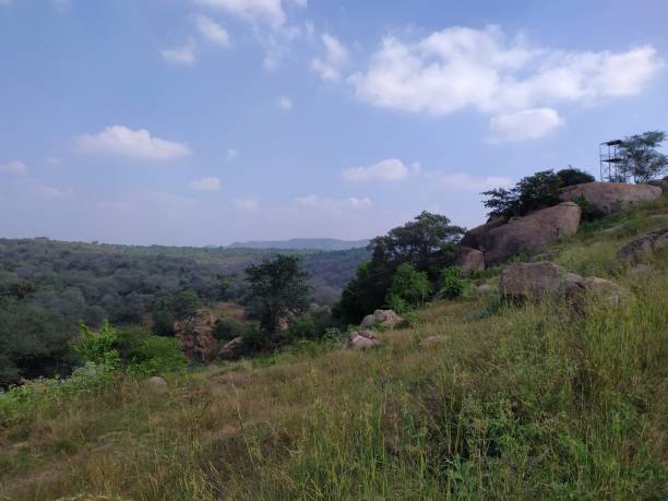 istock Hill station view with rocks and cloudy sky 1197775046