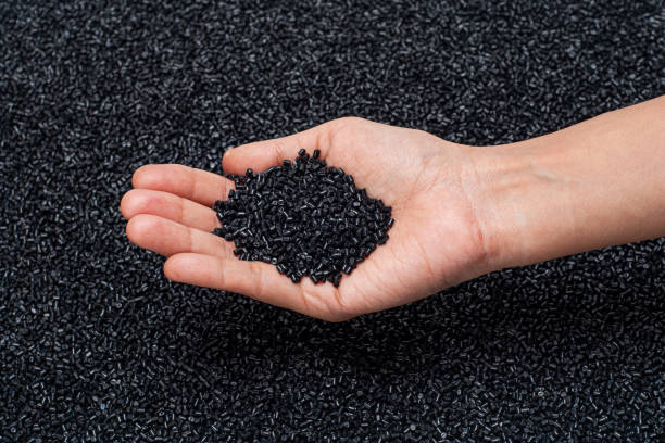 istock CLOSE-UP OF PLASTIC POLYMER GRANULES SPREAD ON EVEN SURFACE 1197775099