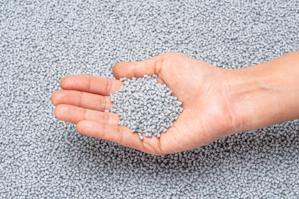 istock CLOSE-UP OF PLASTIC POLYMER GRANULES SPREAD ON EVEN SURFACE 1197775112