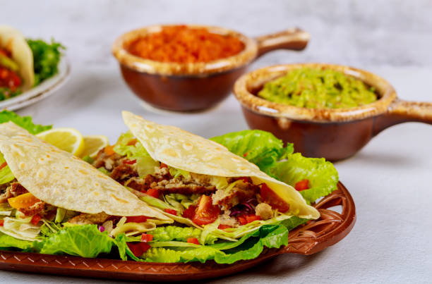 istock Mexican soft tortillas with salsa and guacamole. 1197776839