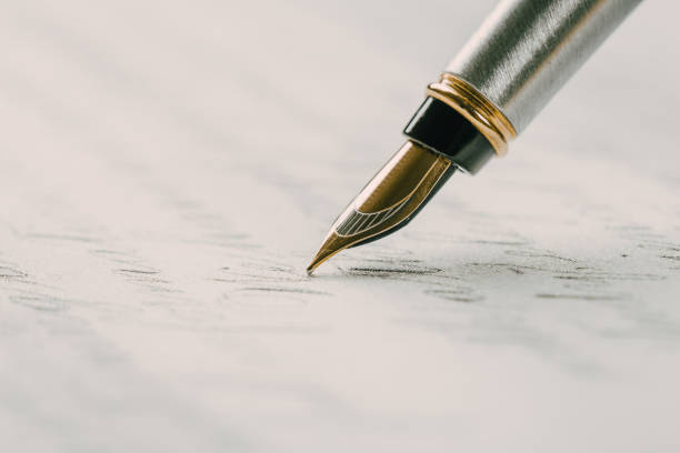 istock Fountain pen on an ancient handwritten letter. Old story. Retro style. 1197781707