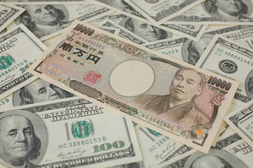 Japanese 10000 yen and 100 Dollar bills