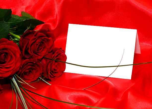 Red roses and blank card stock photo