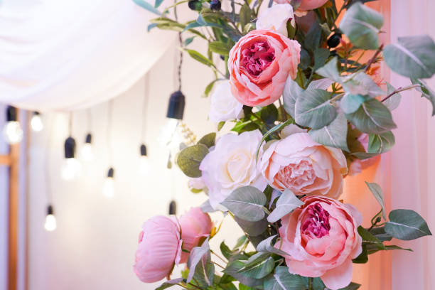 istock wall decorated with roses flower and lighting, with a copy space 1197787282