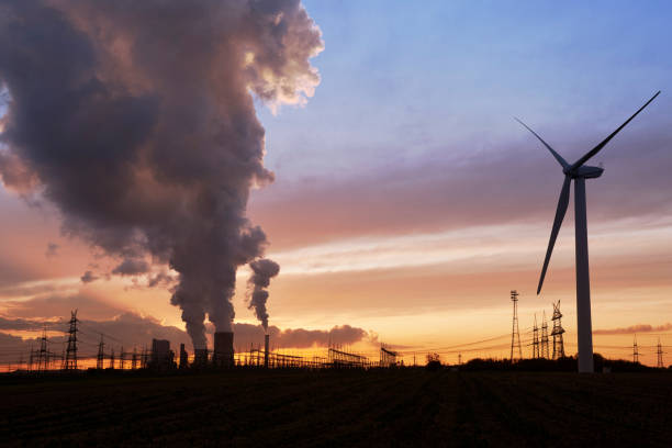 istock Wind energy and coal fired power plant 1197788455