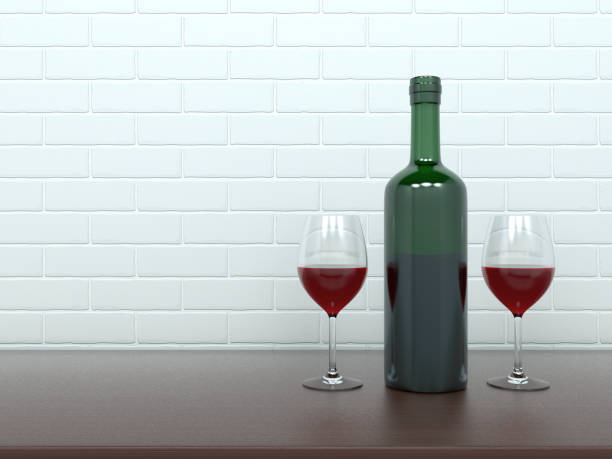 istock Wine bottle with glasses filled with red wine 1197788878