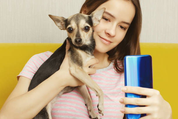 istock Girl makes selfie with a dog 1197790833