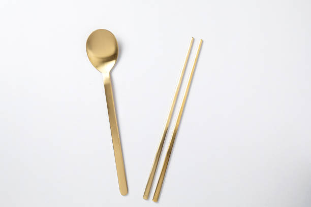 istock golden spoon chopstick korea style on white background 1197794399