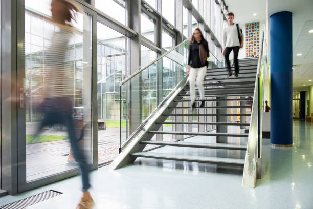 istock High school students walking on stairs 1197796293