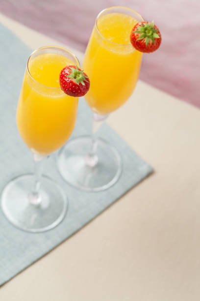istock Mimosa cocktail and strawberries 1197801890