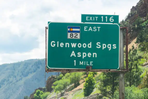 Glenwood Springs i70 interstate freeway highway through Colorado with exit sign on road for 82 east for Aspen