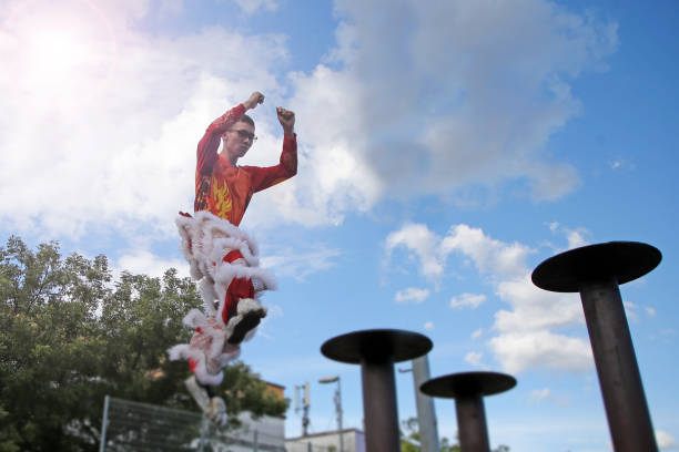 Lion dance troupe member having final practice gearing ready for Chinese New Year performance in Kuala Lumpur, Malaysia.