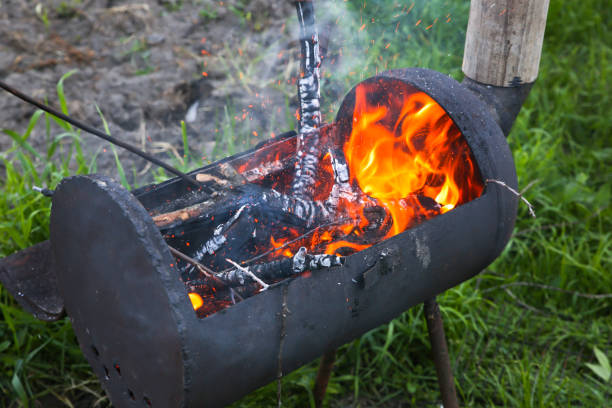 istock Place for barbecue outdoors. Fire with wood. Summer time for grill. 1197804928