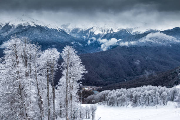 istock High mountain peaks covered with snow on a winter cloudy day 1197806862