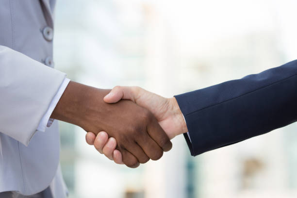istock Multiethnic female leaders greeting each other 1197807220