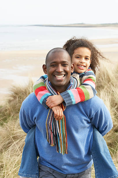 istock Father And Daughter Amongst Dunes On Winter Beach 119780726