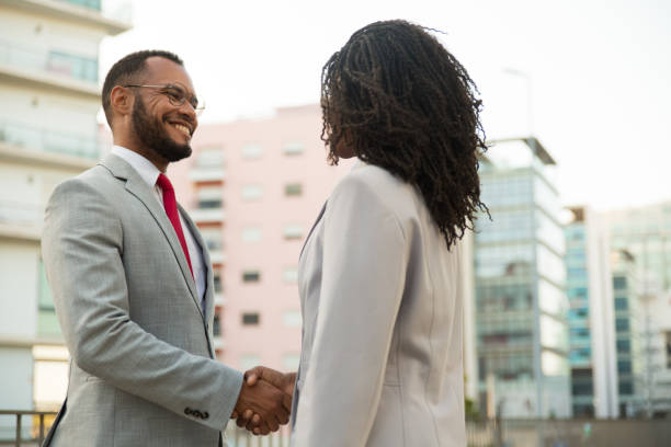 istock Business colleagues greeting each other near office 1197819049