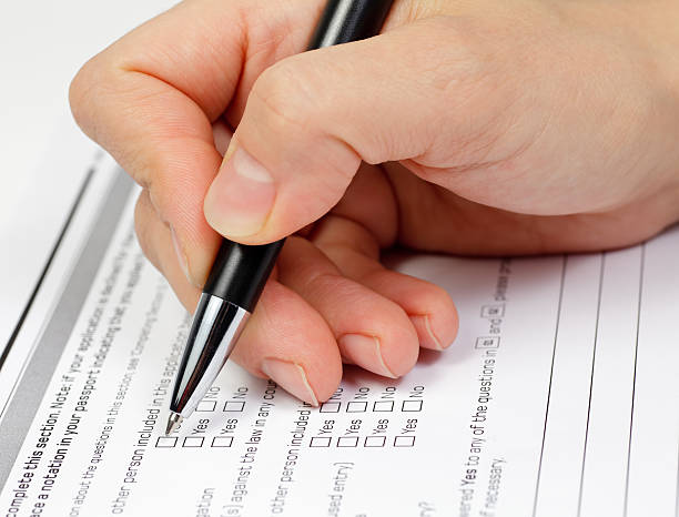 istock Man answering a questionnaire with a black pen 119781992