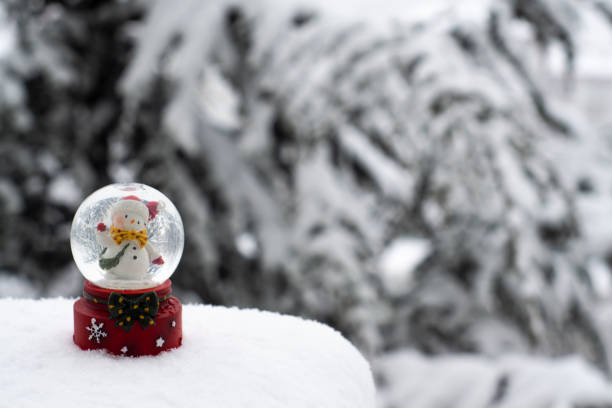 Snow globe on snow background stock photo stock photo